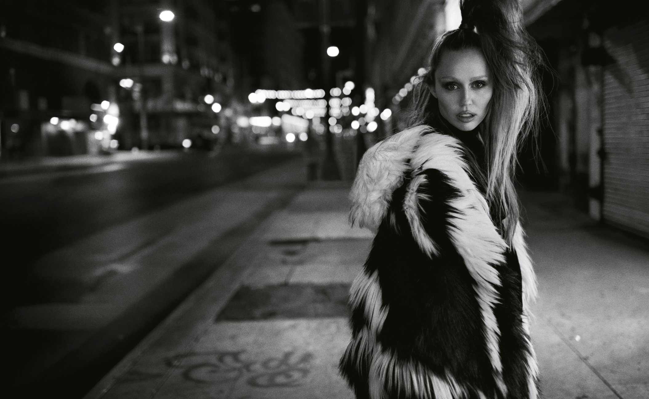 Model with furry coat in Night Street